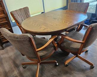 Oak Pedestal Dining Set with Swivel Chairs