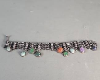 Lot 544  Vintage silver bracelet with colored glass charms