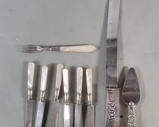 126  Lot 585  Group of sterling band and mother of pearl