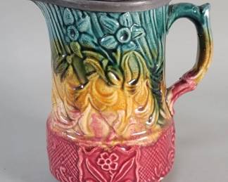 Lot 393  Majolica style ceramic pitcher with hinged lead
