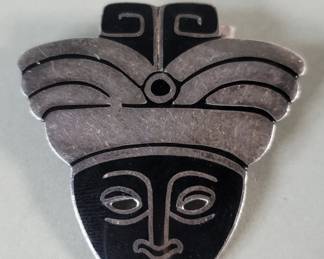 062  Lot 515  Vintage sterling silver and onyx Mexican brooch