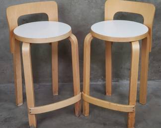 Lot 106  Pair of Alvar Aaltostyle birch wood stools