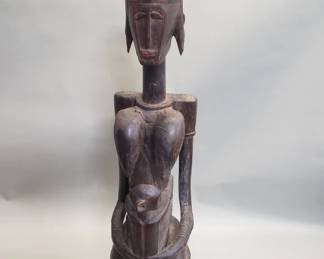 Lot 224  Hand carved wood maternity statue by the Dogon