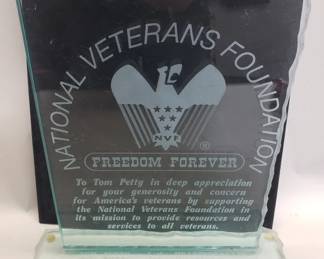 Lot 414  Glass plaque award presented to Tom Petty and