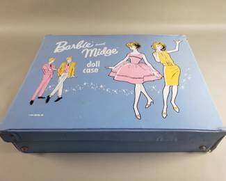 Lot 235  Group of vintage Barbie dolls in case with