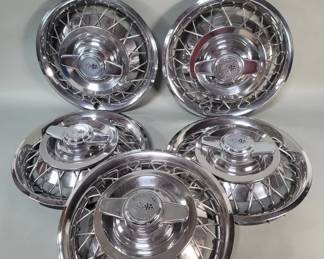 Lot 355  Five vintage Chevrolet hubcaps
