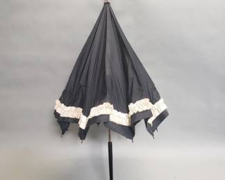 Lot 634  Antique black ruffled parasol