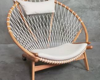 093  Lot 163  Hans J. Wegnerstyle wood and woven roped lounge