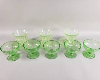 Lot 352  Group of vintage uranium teacups and glass saucers