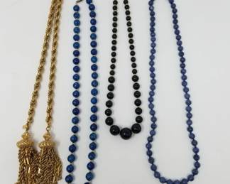 Lot 389  Vintage necklaces  signed Monet goldtone tassel