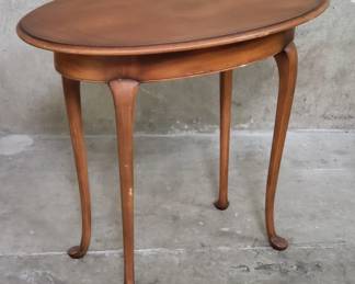 Lot 136  Queen Annestyle walnut finish oval side table