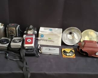 Lot 609  Group of vintage cameras with accessories