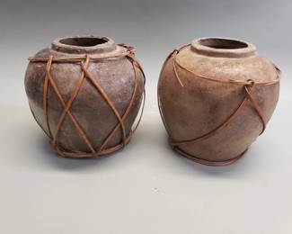 Lot 211  Pair of rustic pottery vessels