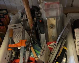 Bins of hand tools, saws, clamps, and woodworking tools