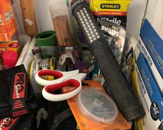 Bins of lights, hand tools, adhesives and more