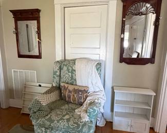 Armchair, throws, storage, and wall mirrors