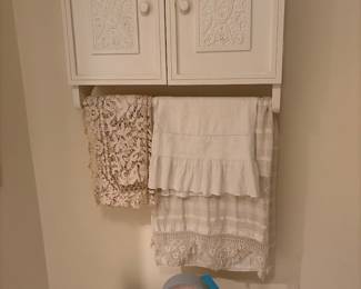 Linens and bathroom cabinet 