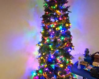 Pre-lit slim pencil artificial Christmas tree.