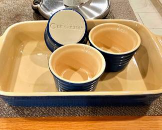 Le Creuset stoneware casserole dish plus 3 ramekins.