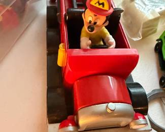 Vintage toy fire truck with Disney character figures
