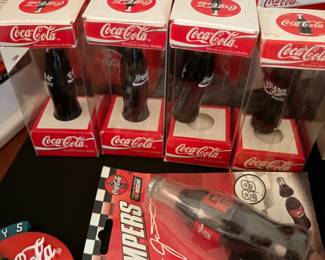 Coca-Cola miniature bottles in individual boxes and bottle stampers