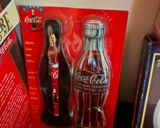 Coca-Cola bottle-shaped tin set on display card