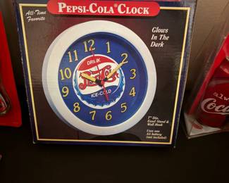 Pepsi-Cola glow in the dark wall clock and Coca-Cola polar bear puzzle