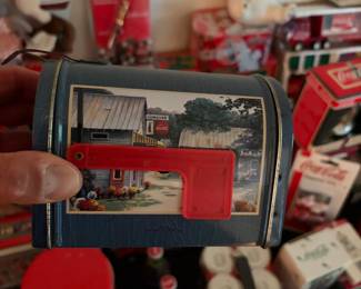 Coca-Cola collectible tin with vintage delivery artwork