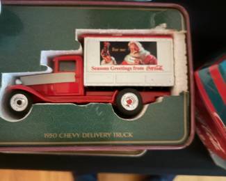 Coca-Cola collectible tin with vintage delivery truck
