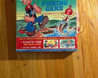 Vintage Fishing Game with plastic fish, rods and reels