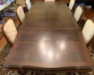 Formal dining table w/ eight chairs. Fully extended: 162” L x 44” W. Condensed: 74” L x 44” W. Each insert (four) measure 22” L x 44” W. 