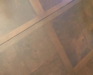 Dining table surface (burled walnut veneer) in parquet pattern.