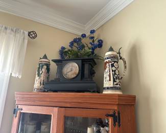 antique clock with steins
