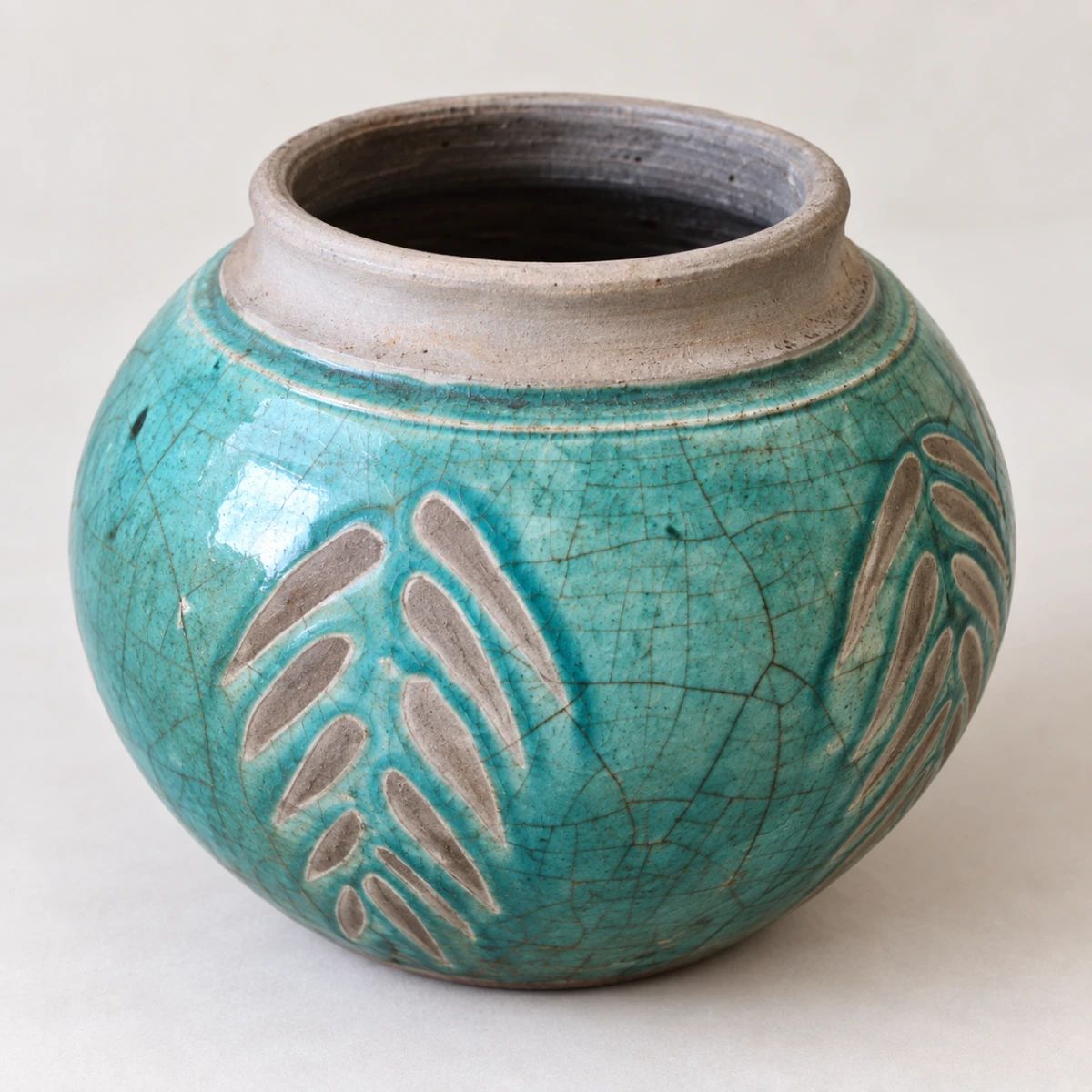 Turquoise Pottery Vase with Leaf Design