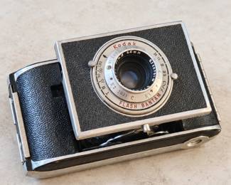 Kodak Flash Bantam folding camera with silver-tone trim.