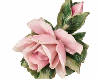 Pink ceramic flower ornament with green leaves