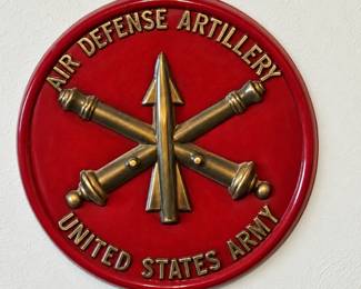 United States Army Air Defense Artillery Wall Plaque ◆ Red with raised gold-tone lettering, crossed cannons, and missile emblem.