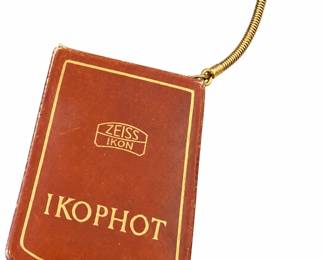 Brown Zeiss Ikon Ikophot case with gold lettering and an attached chain.