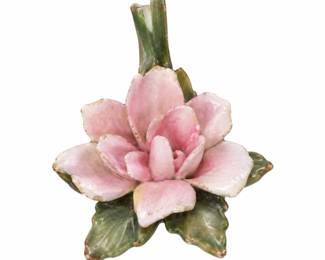 Pink Floral Bud Vase — Sculpted ceramic flower with layered pink petals, green leaves, and a slender stem-shaped vase opening.