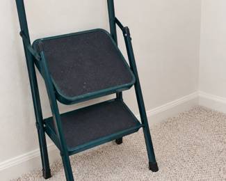 Folding two-step stool with a tall rounded handle
