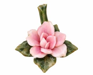 Pink ceramic flower ornament with green leaves