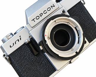 Topcon Uni camera body with silver trim and black textured covering; lens not attached