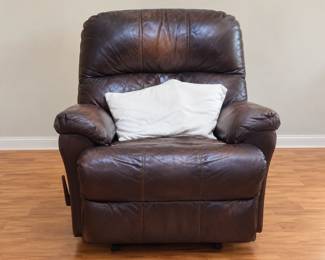 Dark Brown Recliner with Square White Pillows. Pillows and chair sold separately 