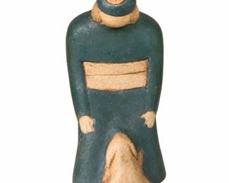 Standing figurine in muted green clothing with a tan hat.