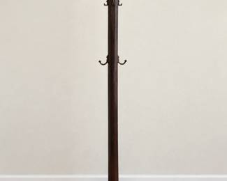 Freestanding Coat Rack Dark wood coat rack with curved hooks, decorative finial, and broad base.