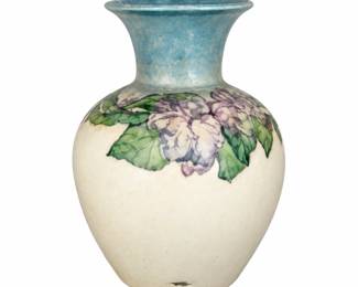 Cream floral vase with a flared blue neck.
