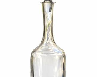 Tall plain glass decanter with rounded shoulders, a long neck, and tapered stopper.