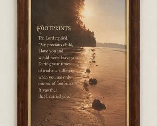 Framed “Footprints” print with a shoreline scene and warm brown frame.