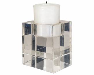 Square glass candle holder with a white pillar candle.