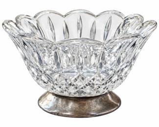 Scalloped cut-glass bowl on a tarnished silver-tone pedestal base.